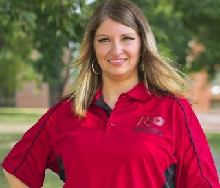 Jennifer Cremeens-King smiles at the camera. She is ready to answer and help prospective students and their families coming to Rio.