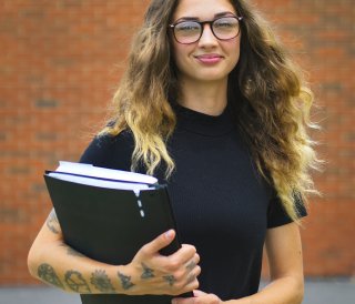 Student Unique Overly holding books