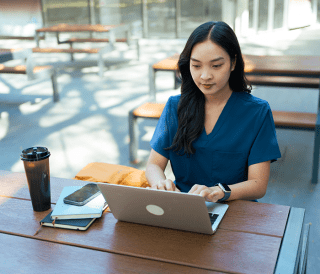 Nurse using laptop computer