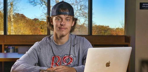 Male student sitting at desk