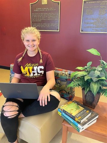 Student sits with laptop at Meigs Center