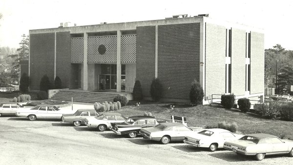 View of Davis library with cars parked in front from 1960s