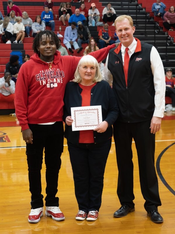 Student Athlete and President Smith recognize Bonnie Gilliland 