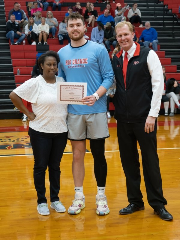 Student Athlete and President Smith recognize Rosie 