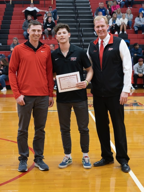 Student Athlete and President Smith recognize AJ Clayton 