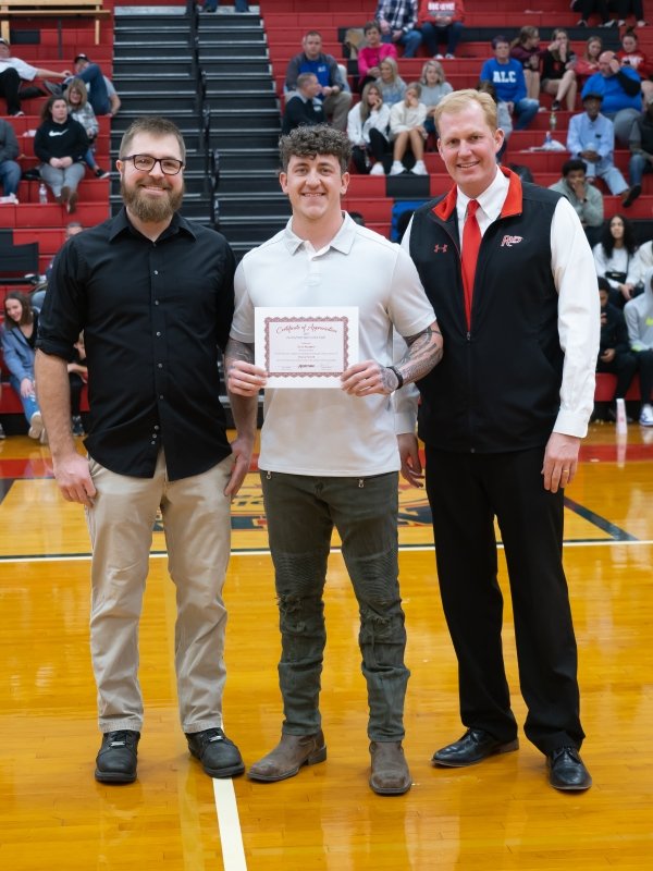 Student Athlete and President Smith recognize Levi Stumbo
