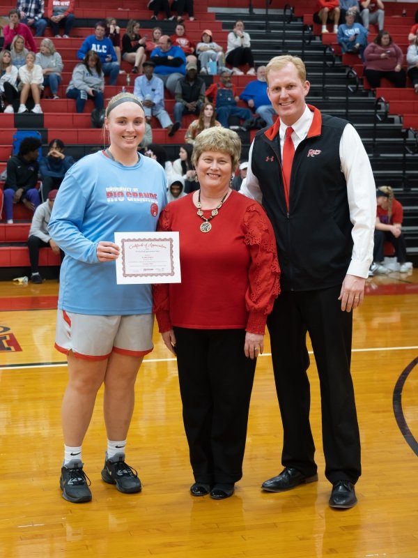 Student Athlete and President Smith recognize Lynley Carey