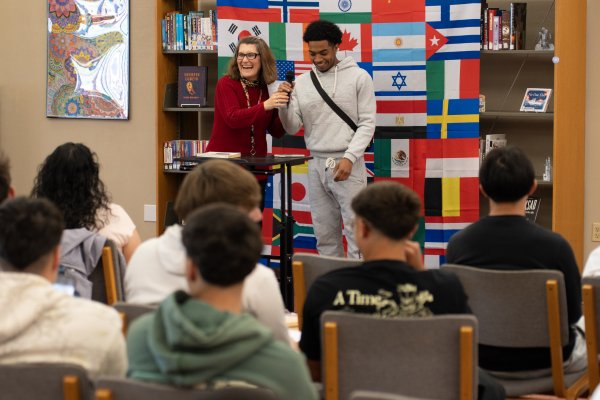 Professor and student speaking at Words of the World Event