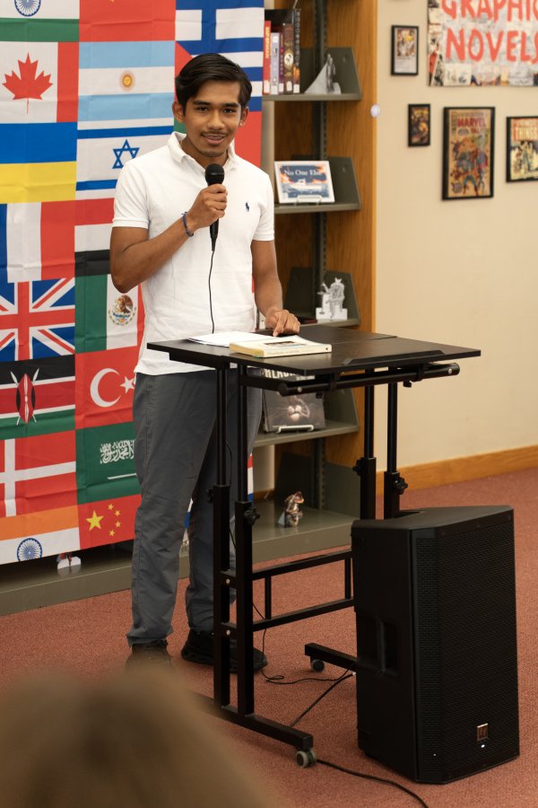 Male student speaking at Words of the World Event