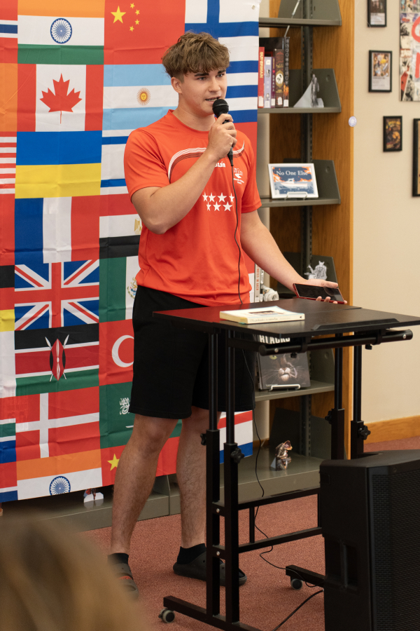 Male student speaking at Words of the World Event