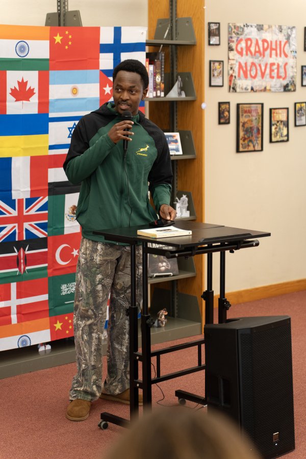 Male student speaking at Words of the World Event