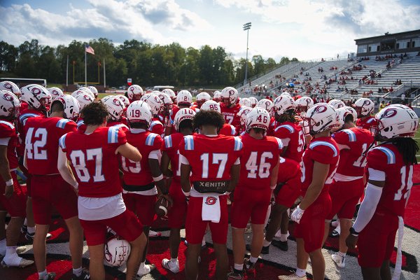 Football players in huddle after game